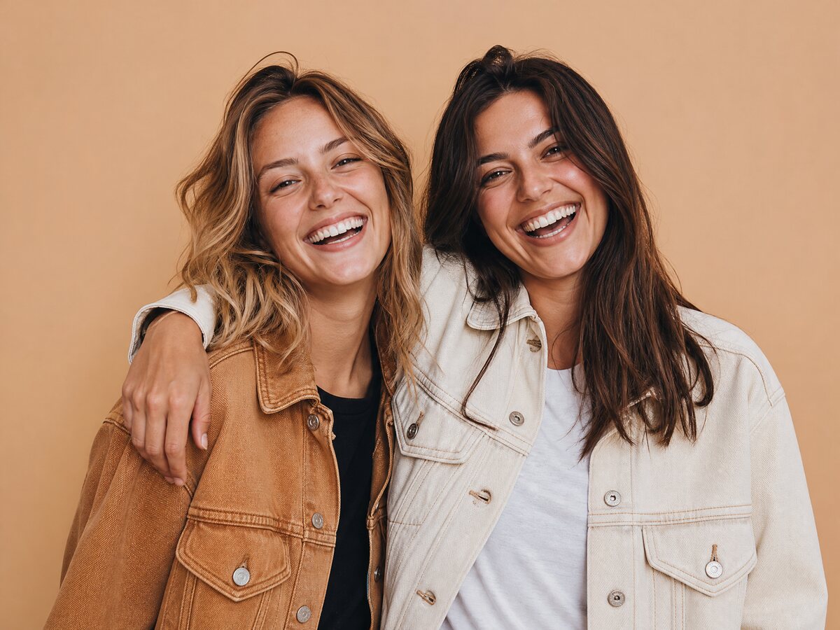 Two friends laughing together in a bright studio, a two-person meme scene